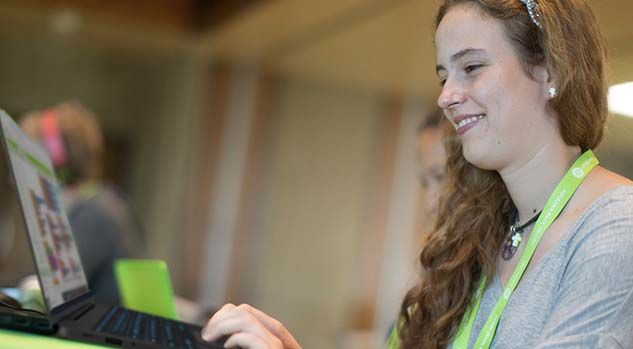 girl smiling working on app project