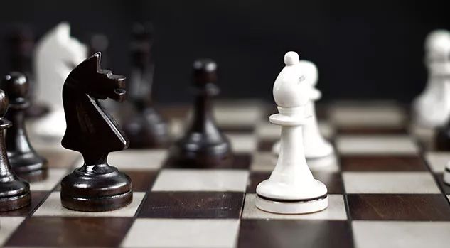 chessboard with black and white pieces